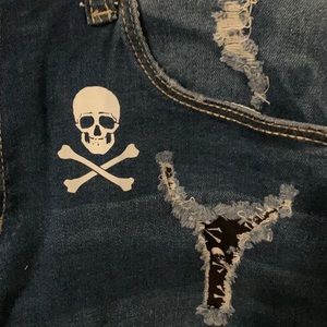 Shorts size small, skull front & back. Has tears but cloth under holes